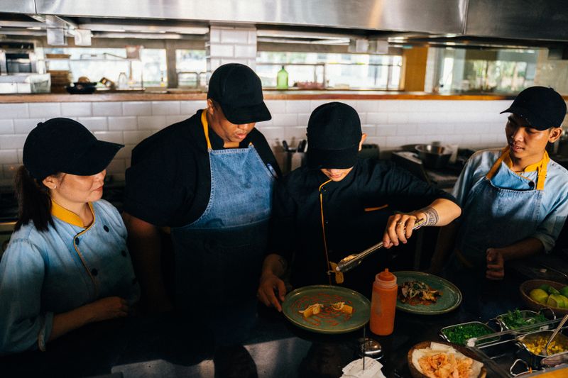 Cafe Rio franchise kitchen team preparing fresh food